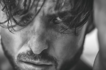 close up,portrait of a beautiful man by the window hair,eye