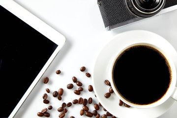 Top view of black coffee and blank notebook