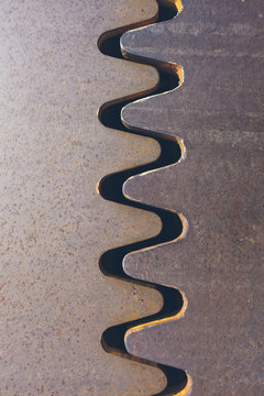 Detail of joined metal plates on urban sidewalk