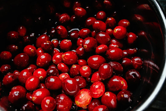 Fresh Ripe Cranberries being prepared in a Saucepan