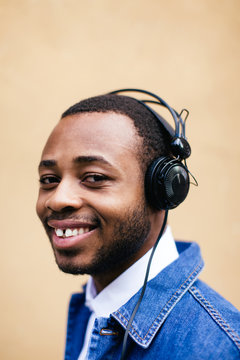 Portrait Of Man Listening Music With Headphone
