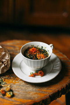 Mixed herbs tea in a white cup