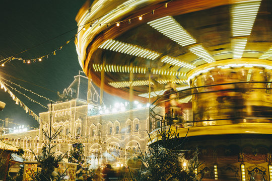 Illuminated carousel in motion