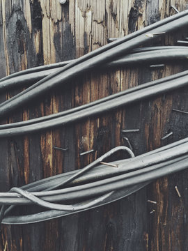 Close up of electrical wire around telephone pole