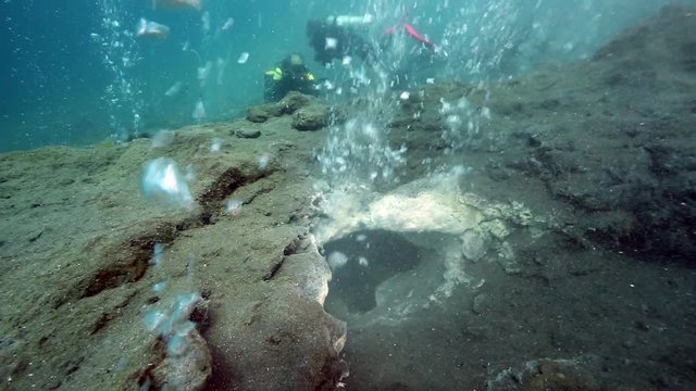 Scuba diving over hot bubbles from underwater volcano, Pulau Weh, Aceh, Indonesia 