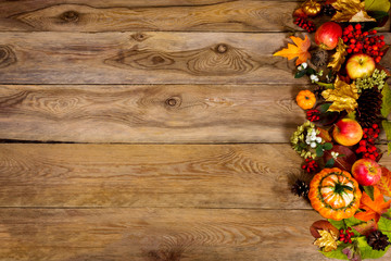 Thanksgiving background with pumpkin, apples and golden leaves, copy space