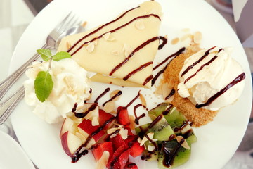 crape cream ice cream with fruit on white plate