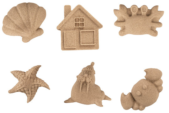 Molded sand animals and toys, isolated on white background.