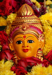 Hindu Goddess asta lakshmi idol on Flower arrangement called Bathukamma during Dussera celebrations