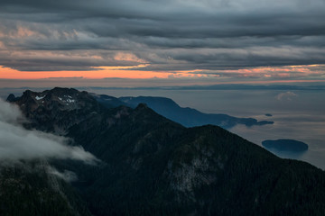 Aerial landscape view of the beautiful mountains North of Vancouver, near Howe Sound, British Columbia, Canada, with Horsebay in the background.