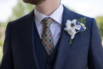 Groom with White and Blue Boutonniere 