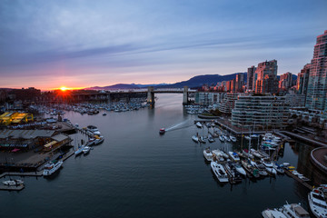 Fototapeta premium False Creek in Downtown Vancouver, British Columbia, Canada. Taken from an aerial perspective during a colorful sunset.