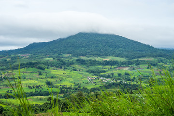 Fototapeta premium Aerial view of hills in rural covered with fog in the morning