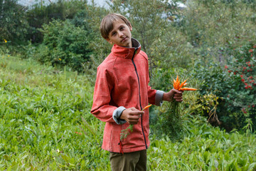 Teenager boy eating carrots