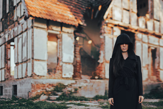 Mysterious Evil Spirit in Front of a Horror Abandoned House