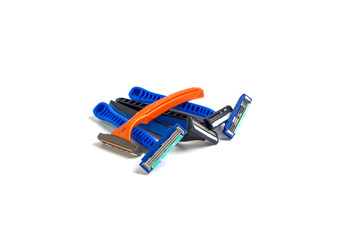 Dirty shaved razor and different orange color on white background, clipping path