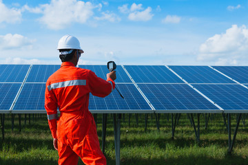 engineer checking job routine of labor working on cleaning solar panel at outside ; operation...