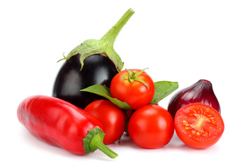 Assortment of fresh raw vegetables isolated on white background. Tomato, eggplant, onion, chili pepper, garlic, spices.