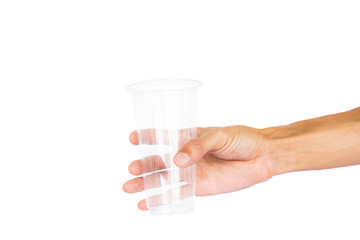 Hand holding plastic cup isolated on white background with clipping path.