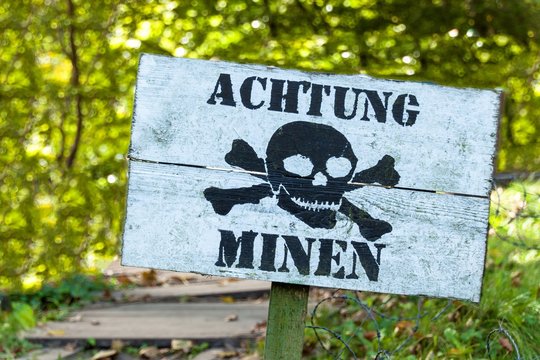 Warning of mines. Danger of explosion. Line of defense. Military base. German inscription: "Danger mines".