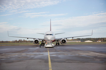 Airplane Being Towed On Runway