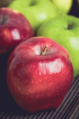 Fototapeta na wymiar Green and red of apples on black background