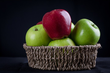 Green and red of apples in the basket