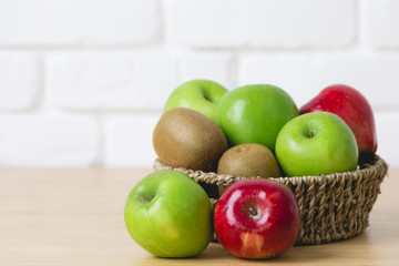 Fresh kiwi, apples on wooden background
