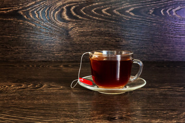 cup of tea on the background wall of wood