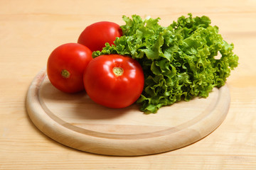 Tomatoes and a salad leaf