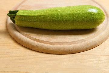 One green zucchini