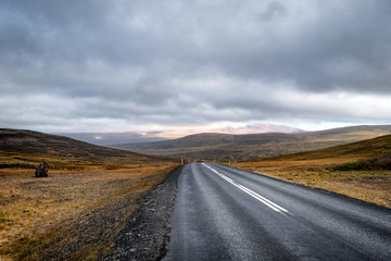 Scenic view of remote road on Iceland surrounded by dramatic landscape.
