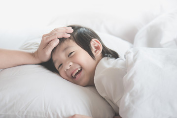 Fototapeta na wymiar Asian child sleeping on white bed