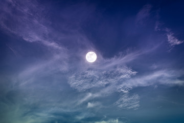 Naklejka na ściany i meble Night sky with bright full moon and clouds, serenity nature background.