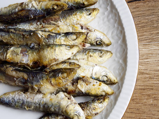 Fried small sardine on a plate
