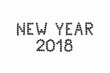 Words NEW YEAR 2018 is made rhinestones black color on a white background.