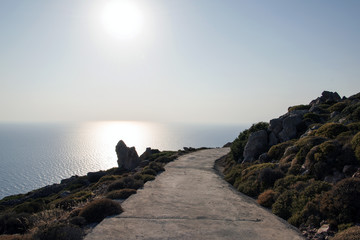 A road in the mountains and a view of seascape