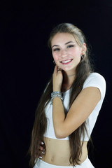 beautiful teenager with long hair in white shirt smiling