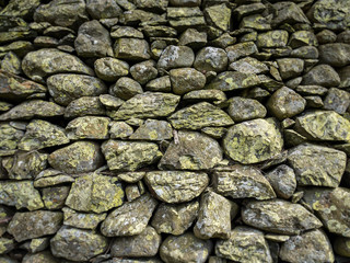 Dry Stone Wall texture. Full frame texture of a traditional British dry stone wall as is typically found in rural Wales and the North of England.