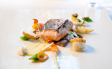 Close up shot of Grilled fish with  grilled vegetables