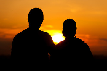 Fototapeta na wymiar Two men enjoying sunset time together
