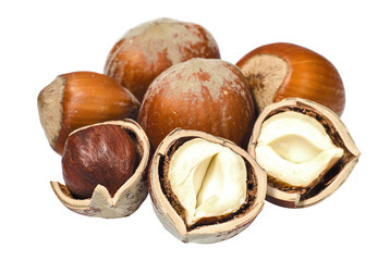 Cracked and whole hazelnuts closeup