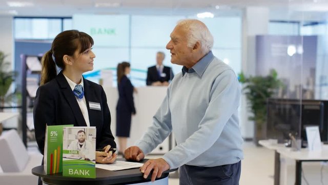  Customers wait to meet with financial adviser in modern bank