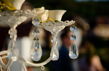 detail of glass decoration at the ceremony with the yellow rose