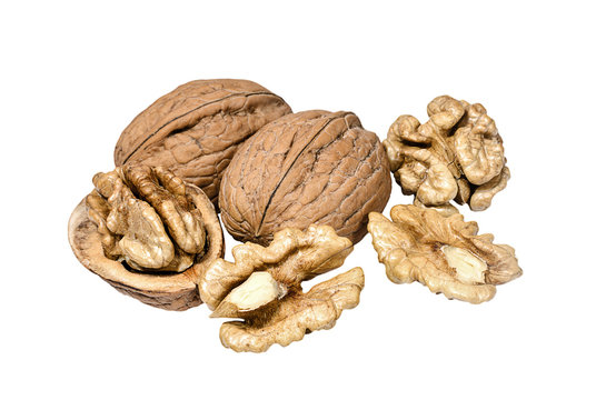 Whole and peeled walnuts closeup