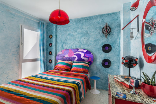 Vintage Bedroom With A 60s Clock, Desk, Records,mirror, Colorful Bedcover And Retro Lamp