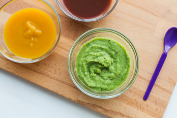 vegetable puree or baby food in glass bowls