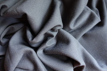 Simple grey viscose fabric in soft folds