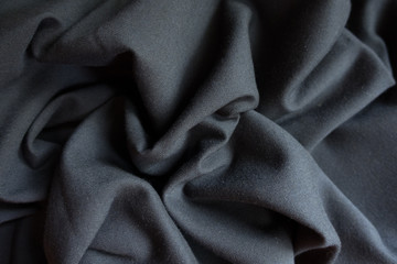 Simple black viscose fabric in soft folds
