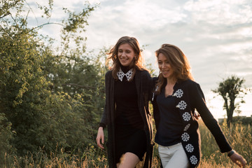 Mother and daughter photographed on the field